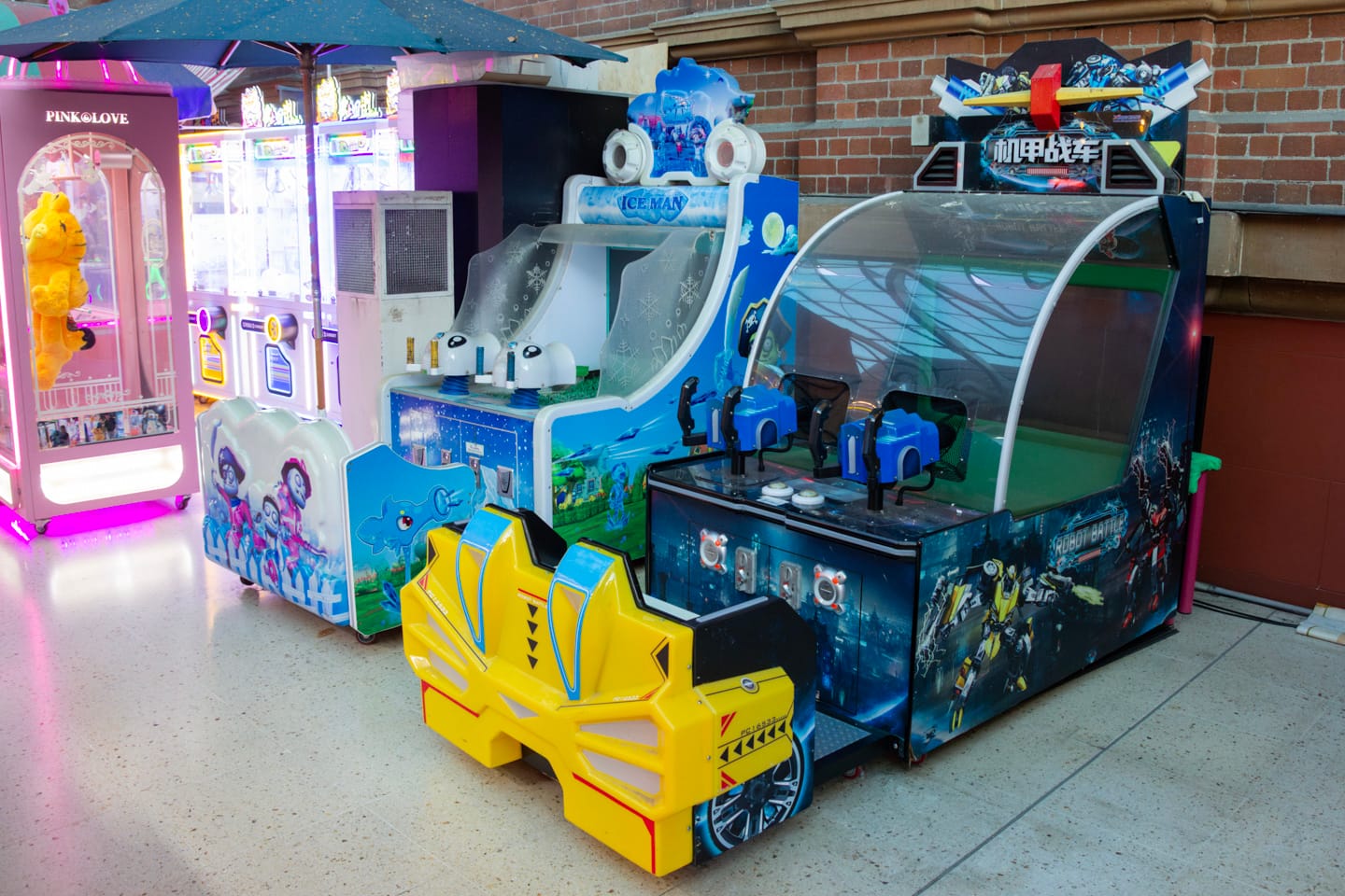 Two water shooter games next to each other in a section at Purikura Photoland, both switched off.