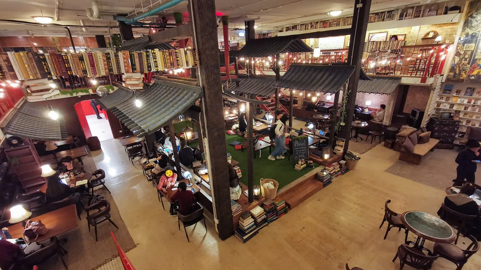 A top-down view of O3 Newtown’s coworking space from the upper floor.